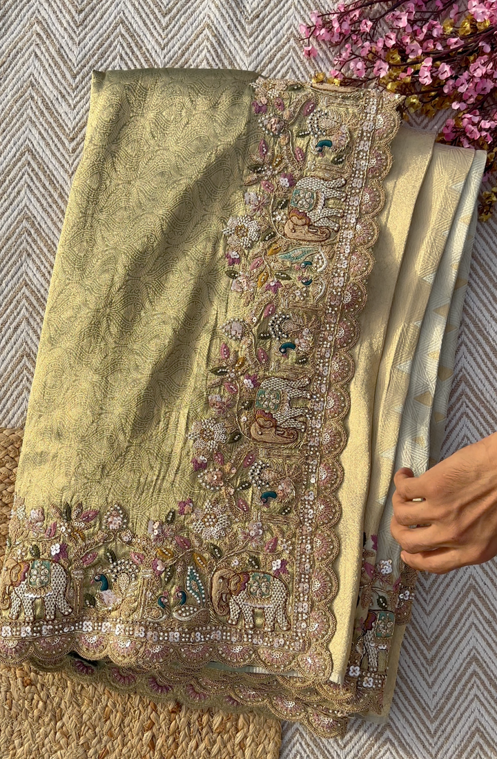 Muted Olive Gold Tissue Silk Saree Embellished with Zari, Cutdana & Zarkan Work