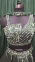 Load and play video in Gallery viewer, Bottle Green Organza Tissue Lehengas With Japanese Cut Dana and sequins Work
