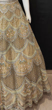 Load image into Gallery viewer, Gold Net Lehenga Choli with Hand Work and Dupatta
