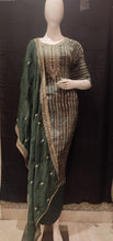 Load image into Gallery viewer, Dark green crape silk semistich suit without sleeves with zari embroidery
