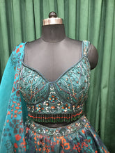 Load image into Gallery viewer, Bottle Green Organza Lehenga Print With Sequins, Jarkan, and Cut Dana

