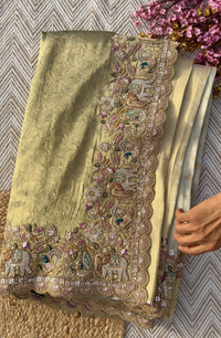 Muted Olive Gold Tissue Silk Saree Embellished with Zari, Cutdana & Zarkan Work