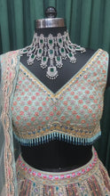 Load and play video in Gallery viewer, Sky Green Net Lehenga With Multi Zari And sequins
