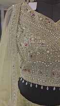 Load and play video in Gallery viewer, Pista Green Net Lehenga With Pearl, Mirror, Zari and Beads Work
